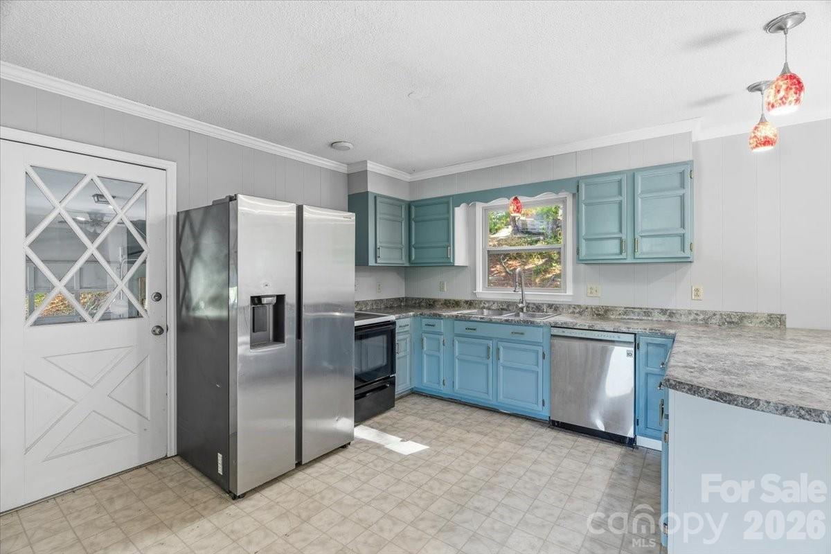 14 Jack Sullins Road Spruce Pine, NC 28777 - Photo 16 of 37 a kitchen with granite countertop stainless steel appliances a refrigerator and a sink