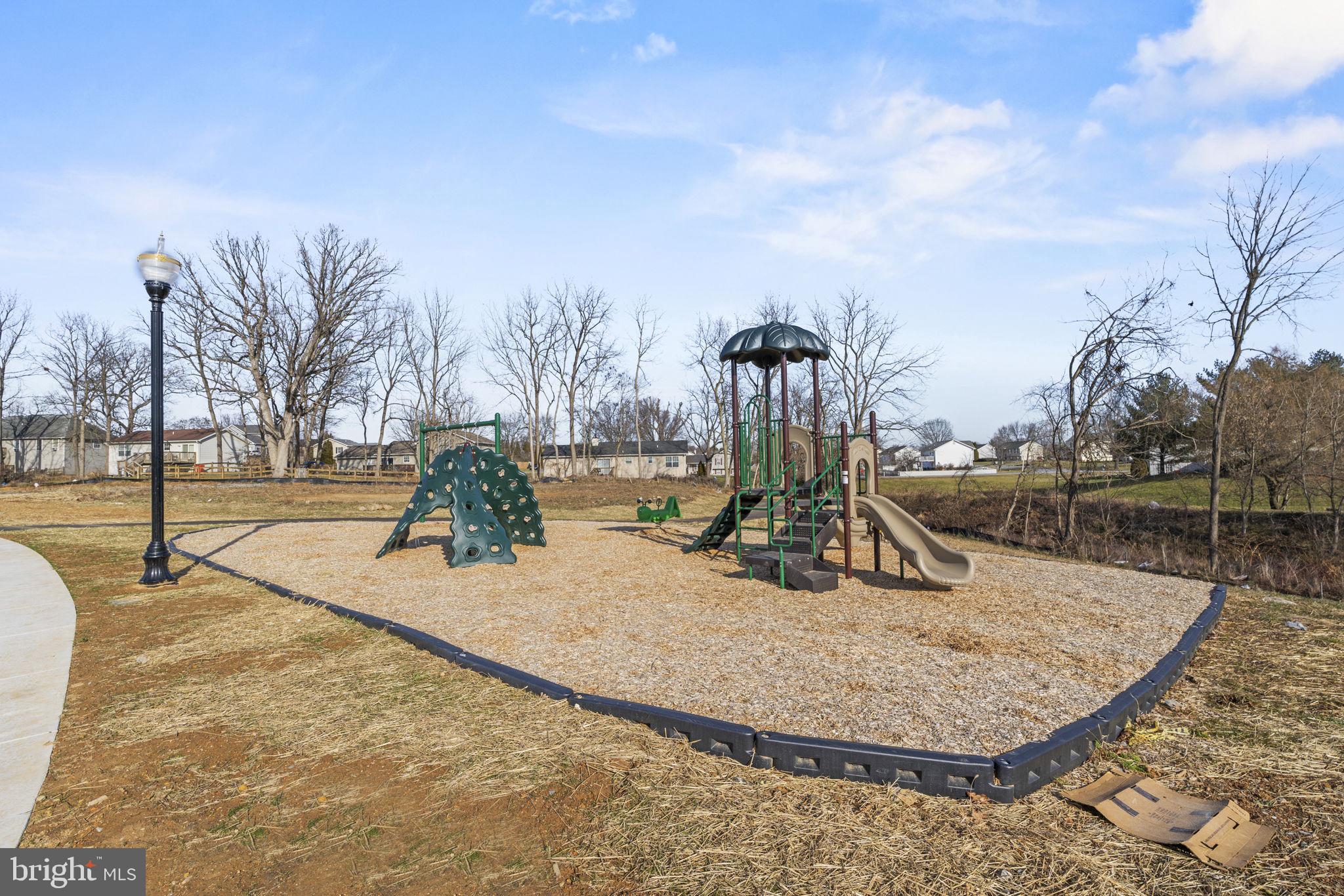 143 Taft Avenue Ranson, WV 25438 - Photo 29 of 46 a view of a park with swings
