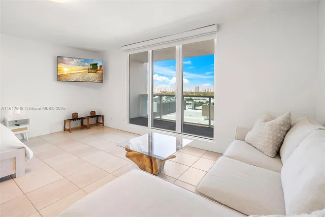 a living room with a large window and a table