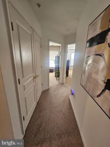 a view of a hallway view with staircase