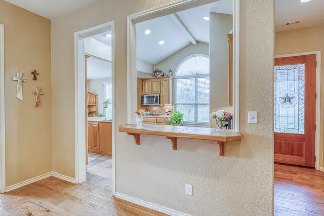a kitchen with cabinets a sink and appliances