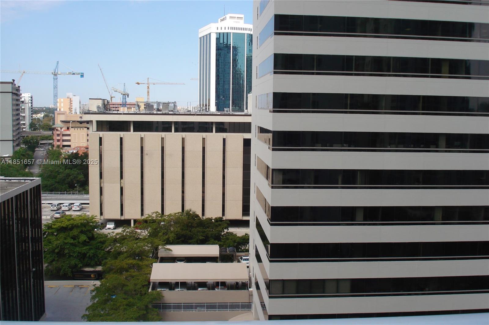 951 Brickell Avenue, Unit 1007 Miami, FL 33131 - Photo 7 of 25 a view of a balcony with wooden floor and fence