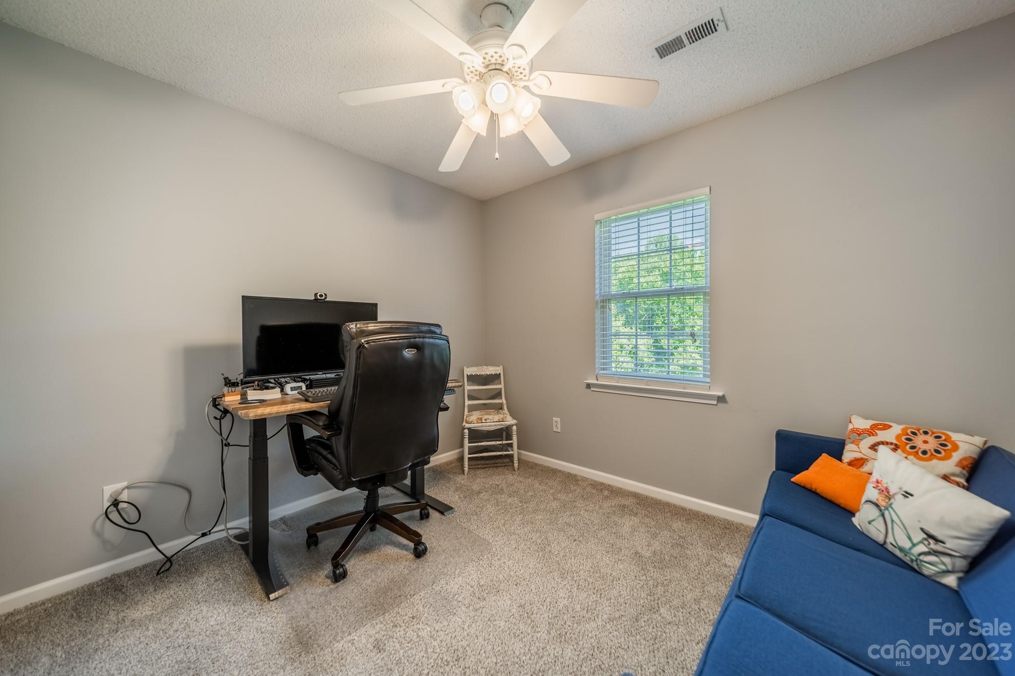 107 Howe Street Belmont, NC 28012 - Photo 20 of 35 a view of a workspace with furniture and a window