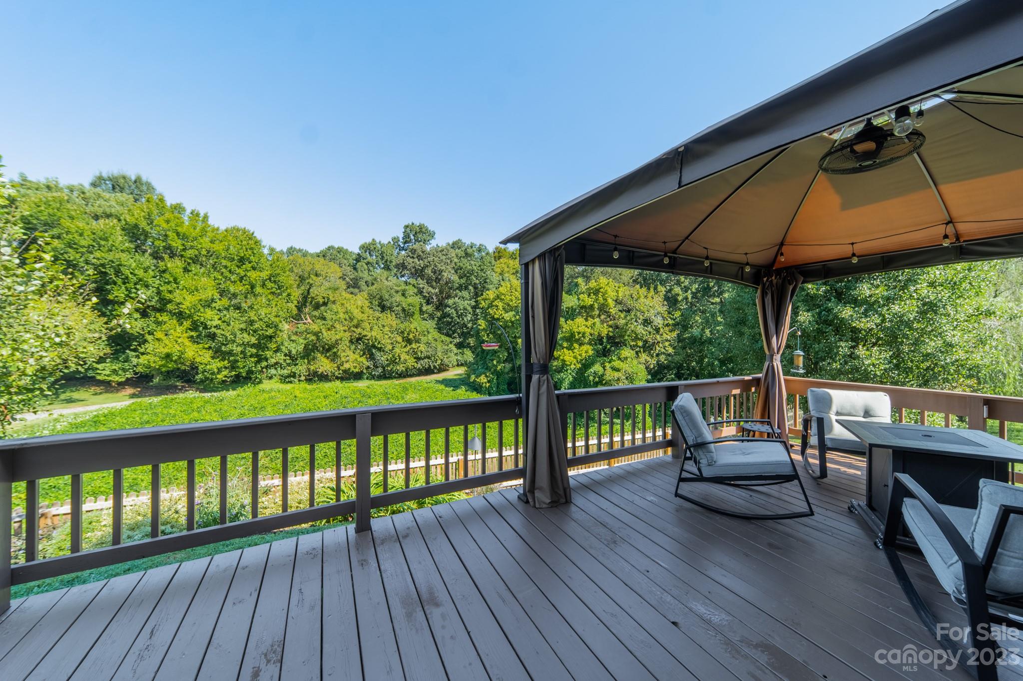 107 Howe Street Belmont, NC 28012 - Photo 26 of 35 a view of a balcony with chairs and wooden floor