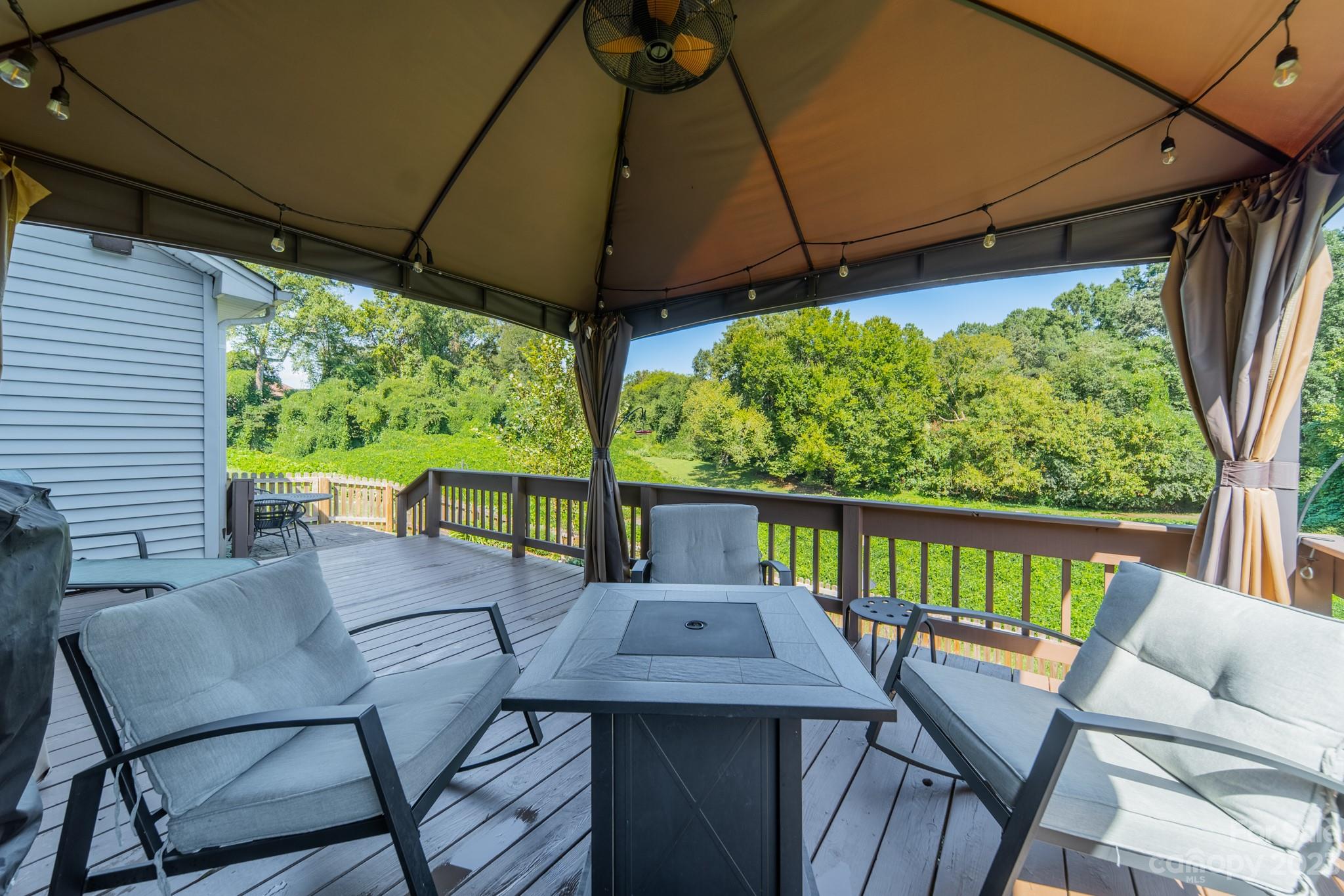 107 Howe Street Belmont, NC 28012 - Photo 27 of 35 a view of balcony with furniture and umbrella