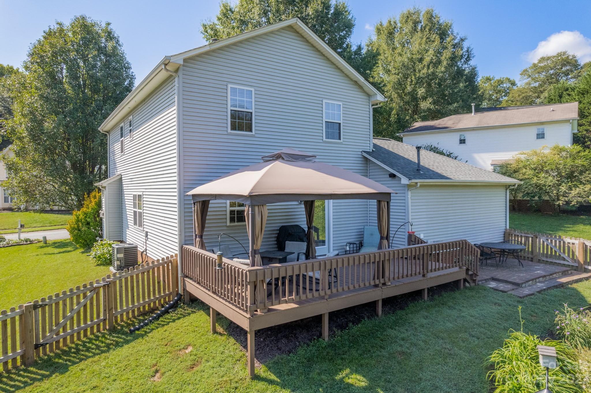 107 Howe Street Belmont, NC 28012 - Photo 30 of 35 a view of a deck with a table and a chairs
