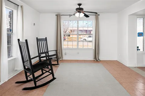 a view of a room with furniture window and wooden floor