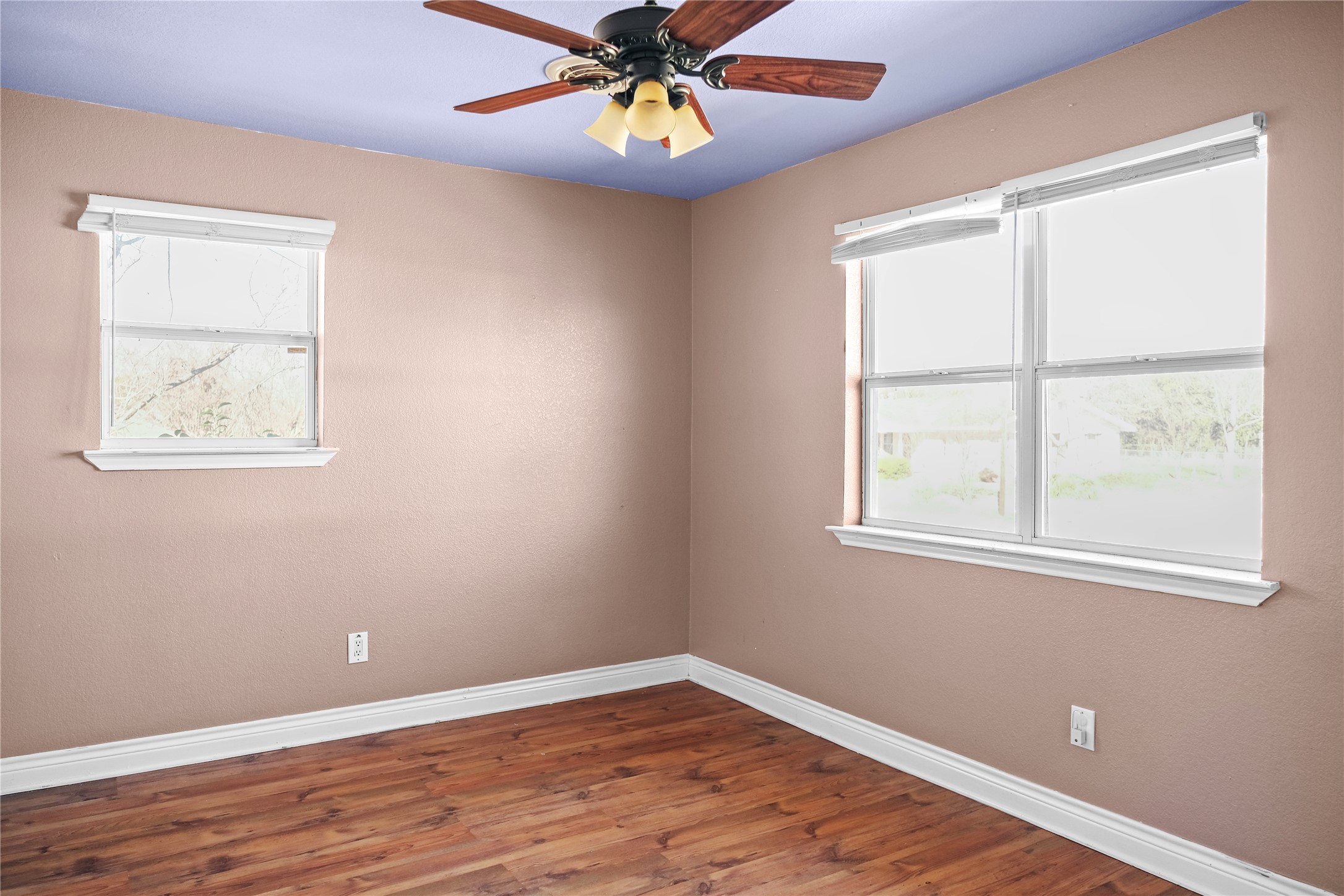 3300 Lake Inks Avenue Killeen, TX 76543 - Photo 24 of 32 an empty room with wooden floor chandelier and windows
