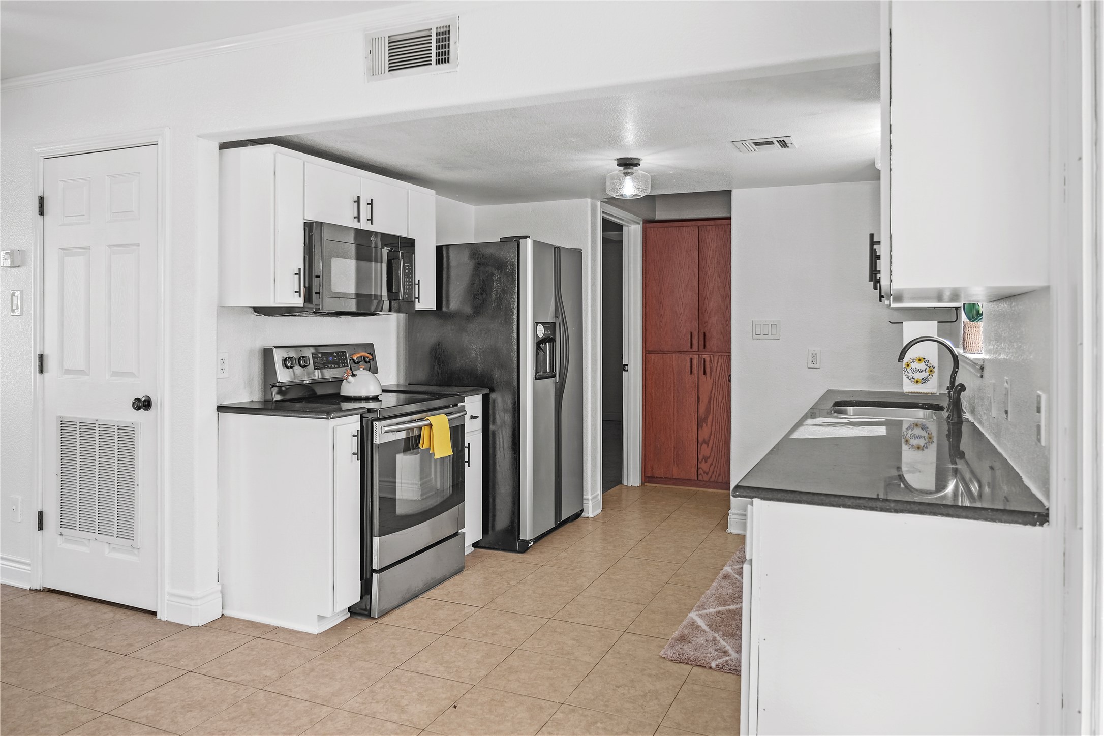 3300 Lake Inks Avenue Killeen, TX 76543 - Photo 6 of 32 a kitchen that has a sink cabinets counter space stainless steel appliances