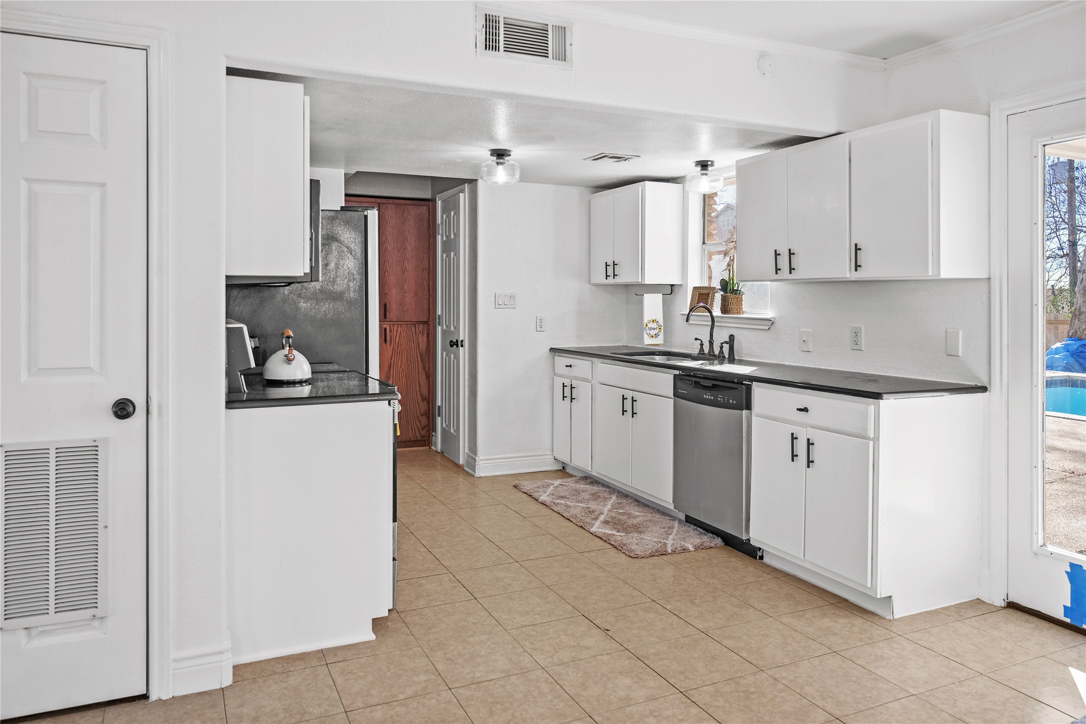 3300 Lake Inks Avenue Killeen, TX 76543 - Photo 7 of 32 a kitchen with white cabinets and sink