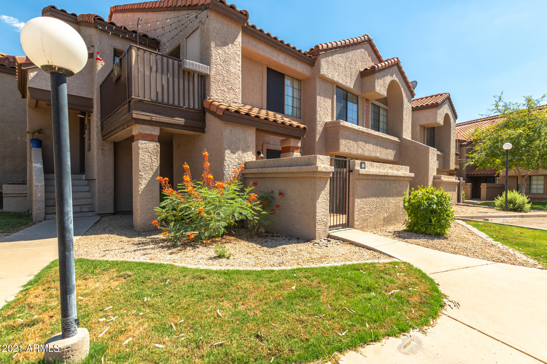700 East Mesquite Circle, Unit R123 Tempe, AZ 85288 - Photo 14 of 28 front view of a house with a yard