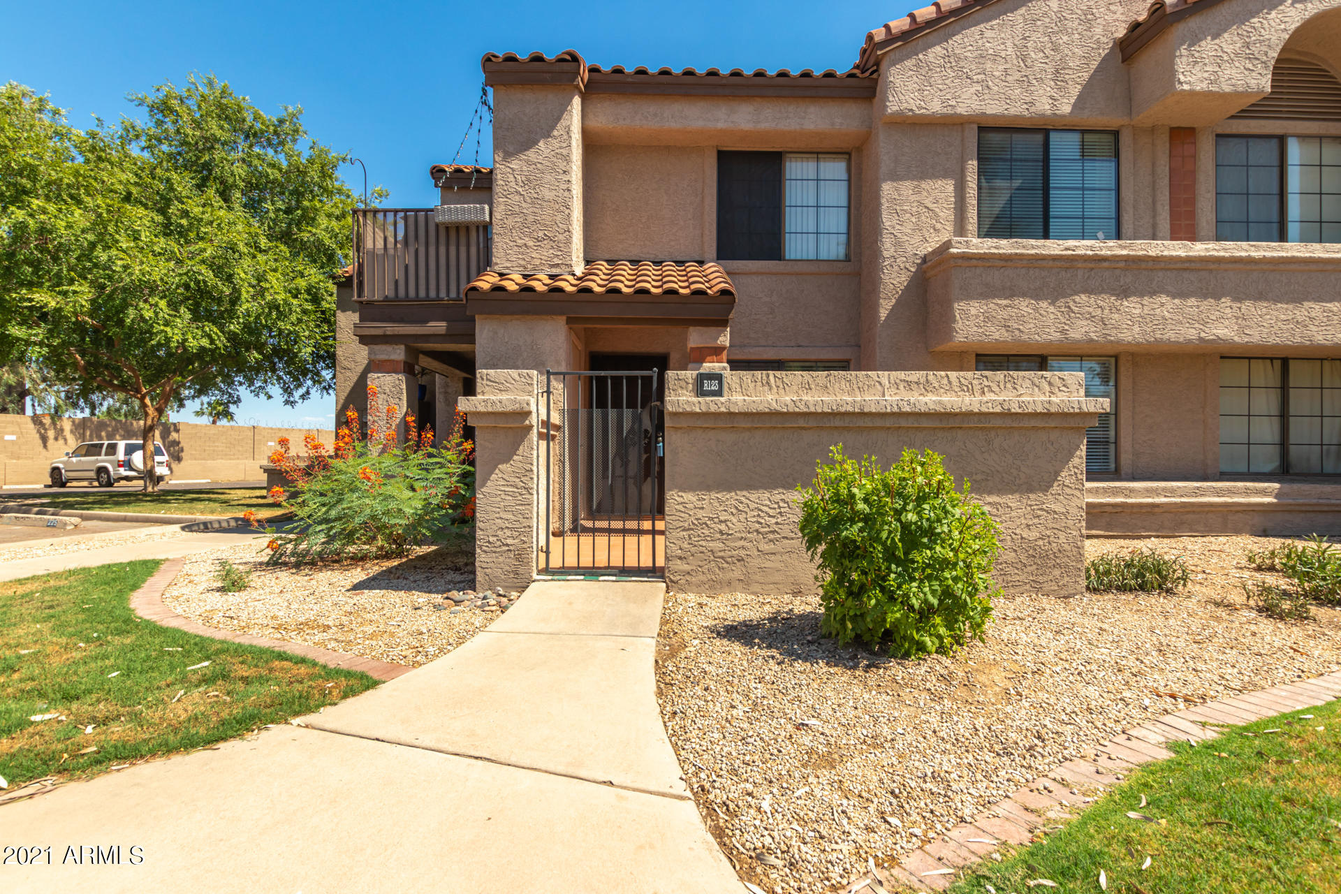 700 East Mesquite Circle, Unit R123 Tempe, AZ 85288 - Photo 15 of 28 a front view of a house with garden