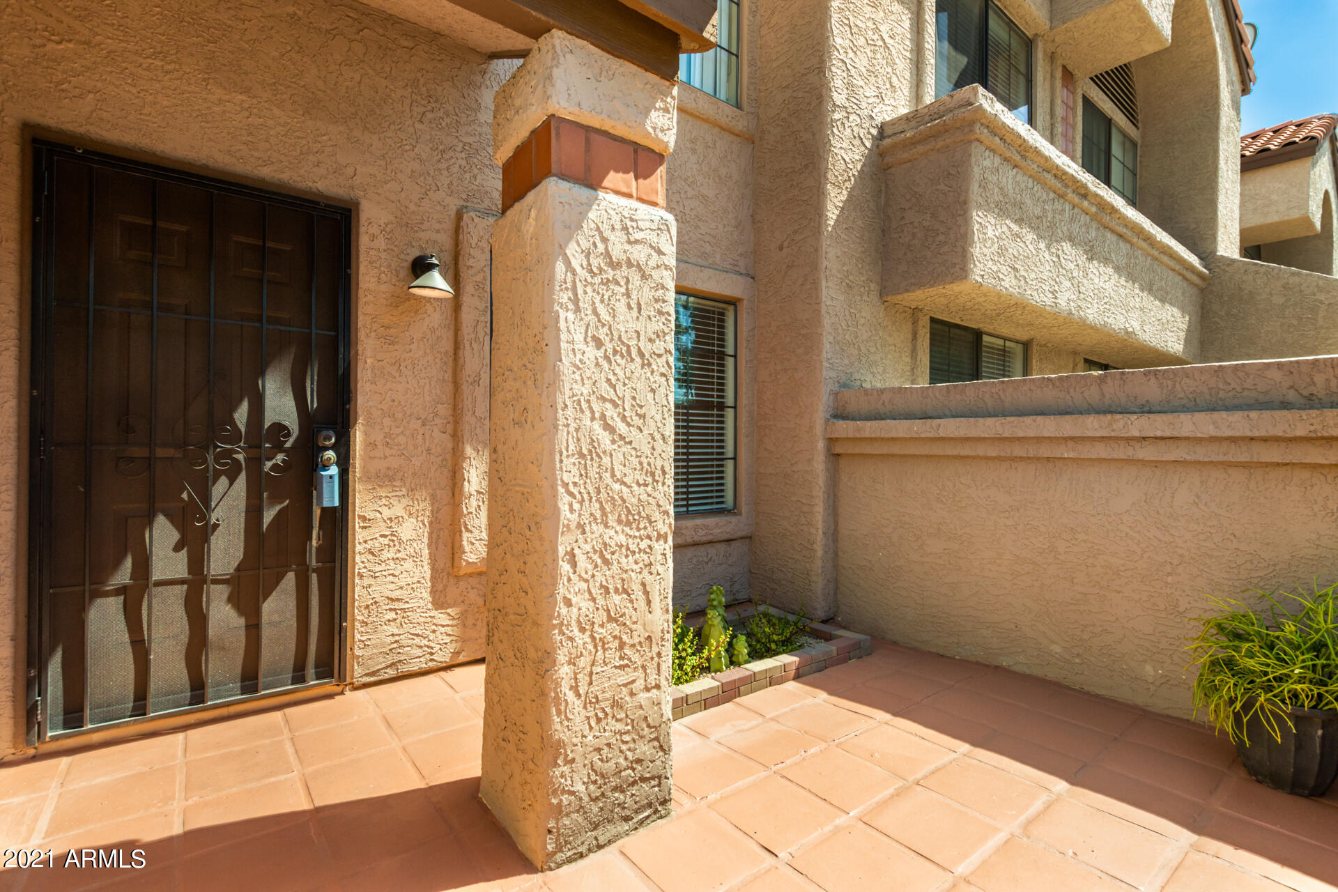 700 East Mesquite Circle, Unit R123 Tempe, AZ 85288 - Photo 17 of 28 a view of a brick house with a large windows