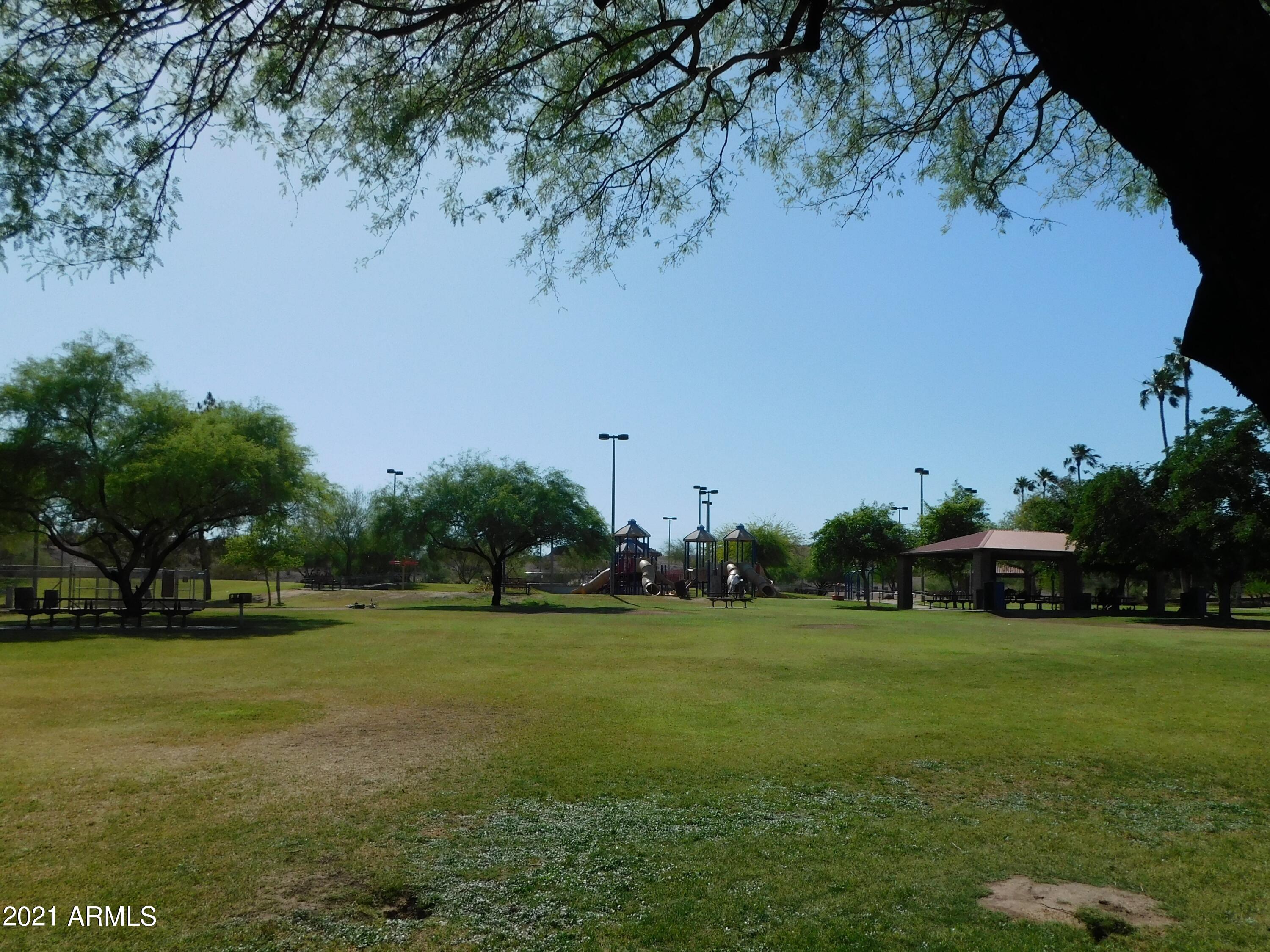 700 East Mesquite Circle, Unit R123 Tempe, AZ 85288 - Photo 24 of 28 a view of a golf course with a lake view