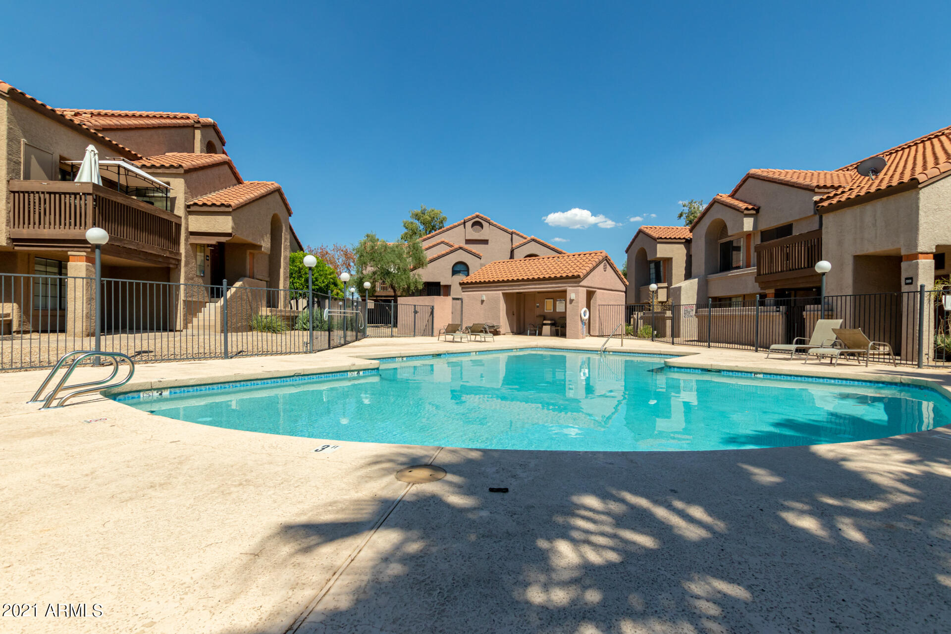 700 East Mesquite Circle, Unit R123 Tempe, AZ 85288 - Photo 25 of 28 a view of a big house with a big yard and a large tree