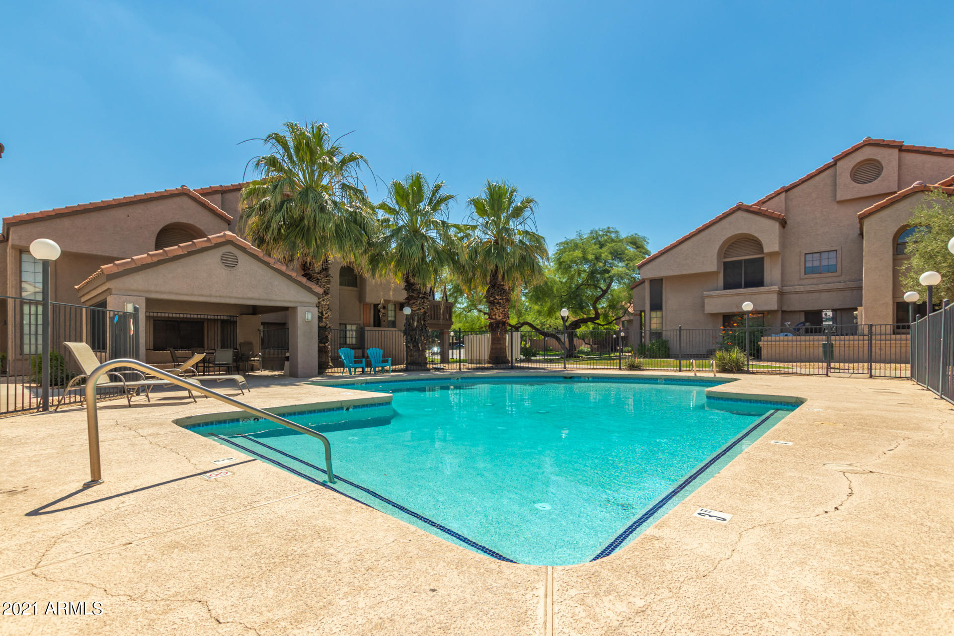 700 East Mesquite Circle, Unit R123 Tempe, AZ 85288 - Photo 27 of 28 a view of a house with pool and chairs