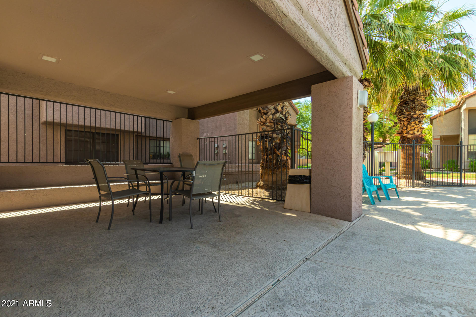700 East Mesquite Circle, Unit R123 Tempe, AZ 85288 - Photo 28 of 28 a view of a porch with chairs and potted plants