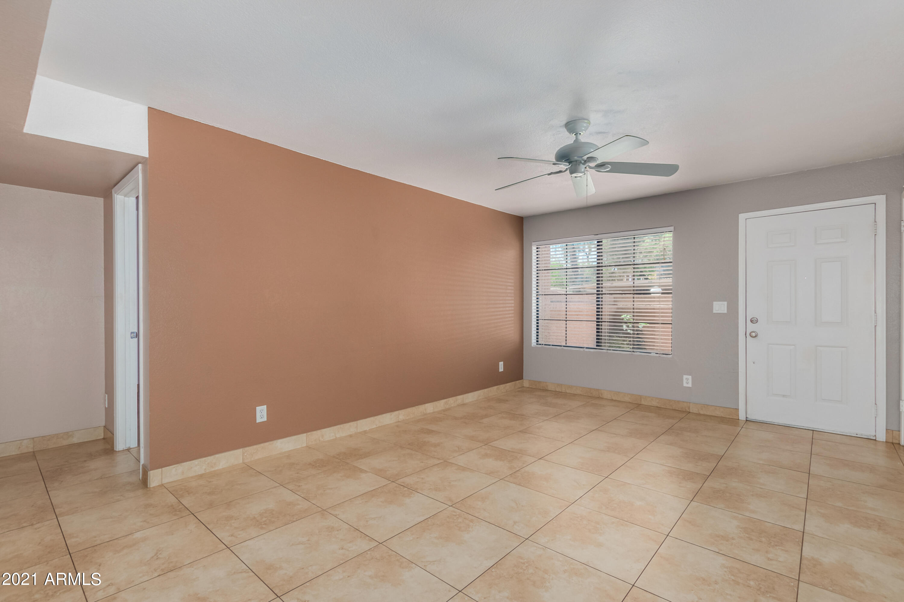 700 East Mesquite Circle, Unit R123 Tempe, AZ 85288 - Photo 4 of 28 a view of an empty room with a window