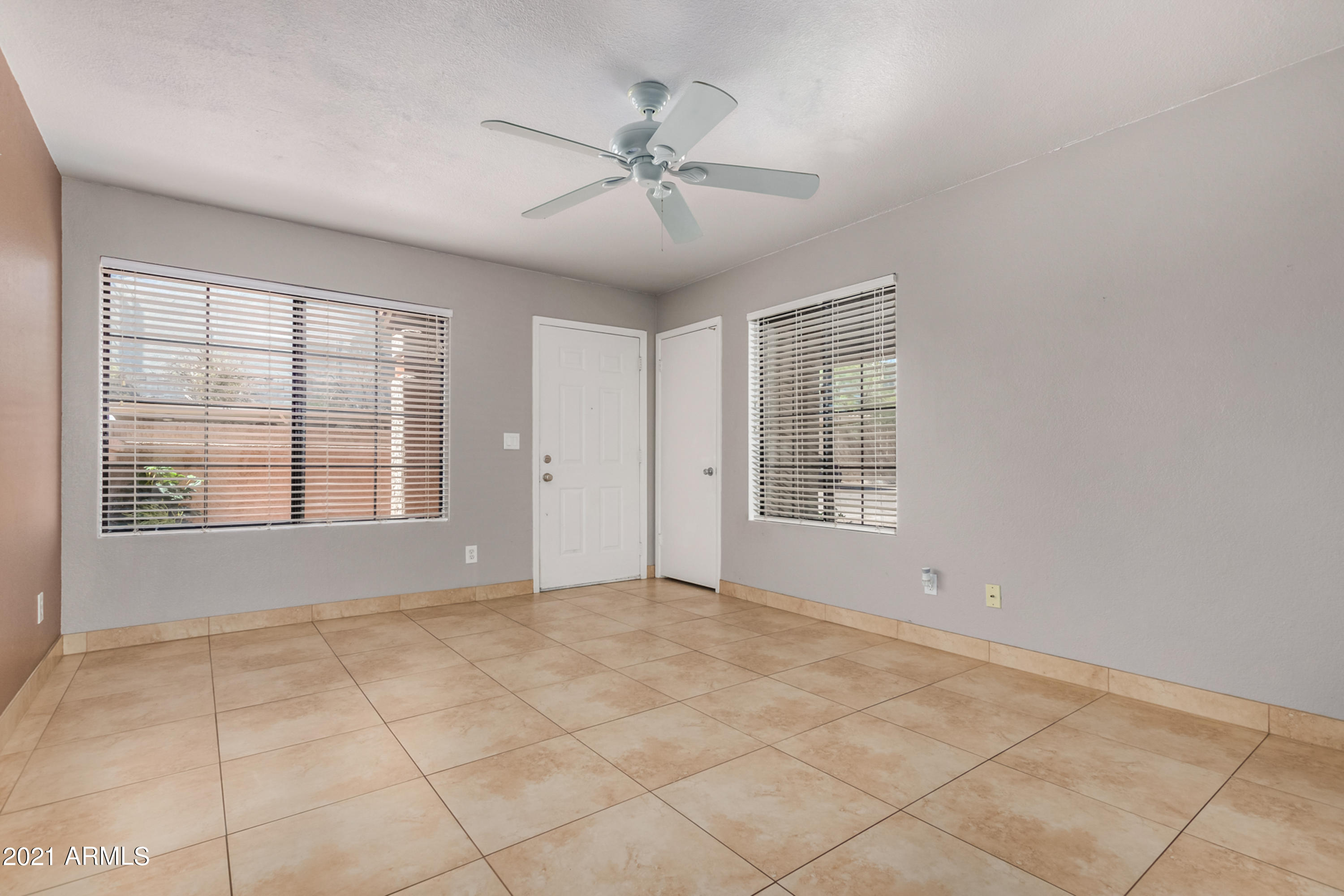 700 East Mesquite Circle, Unit R123 Tempe, AZ 85288 - Photo 5 of 28 a view of an empty room with a window