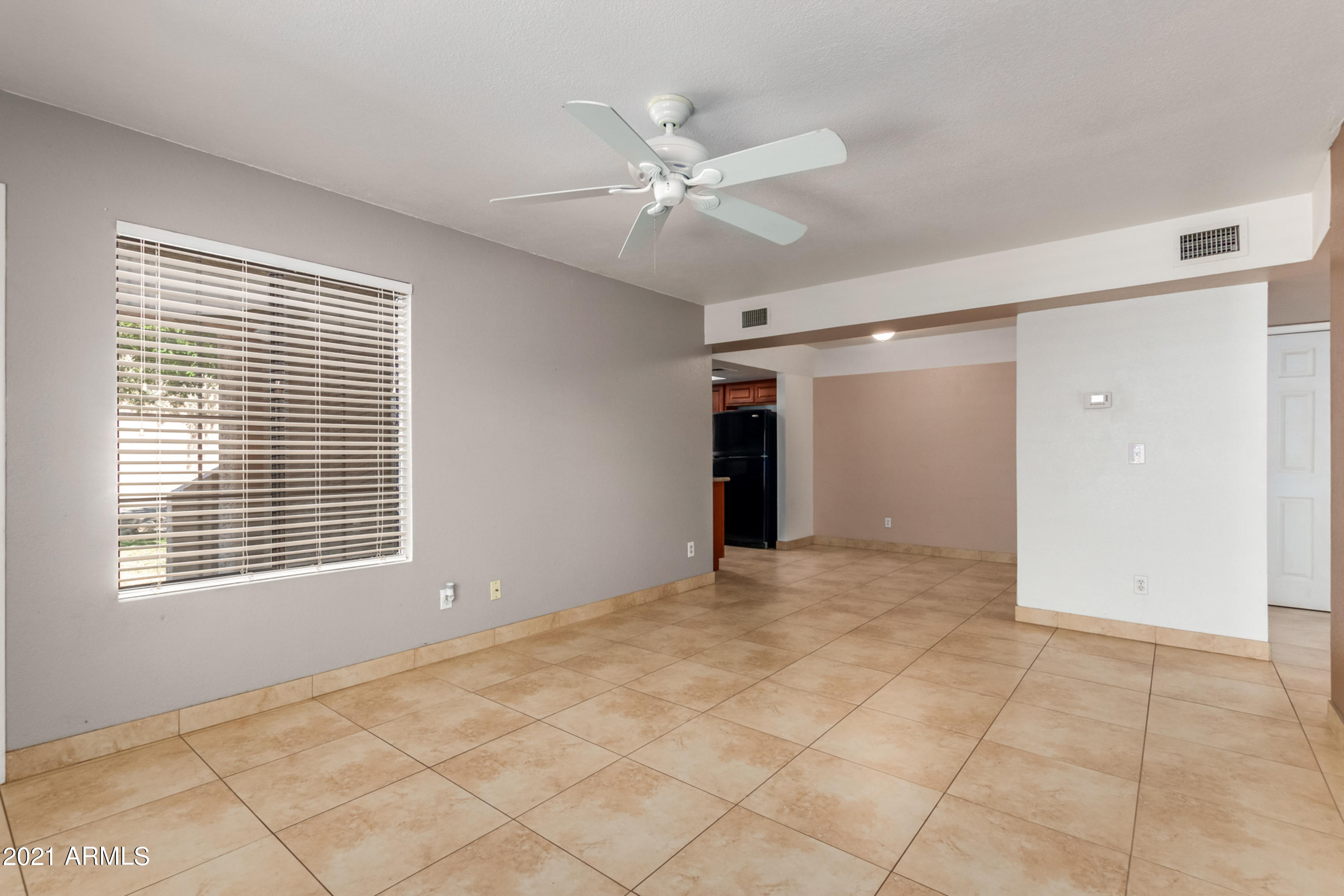 700 East Mesquite Circle, Unit R123 Tempe, AZ 85288 - Photo 6 of 28 a view of an empty room with a window