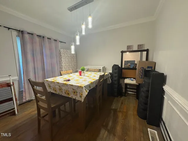 a kitchen with granite countertop a sink stove and cabinets