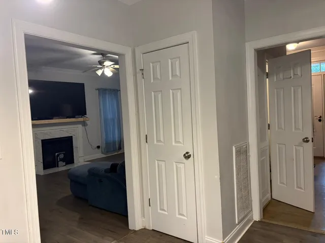 a living room with furniture and a ceiling fan