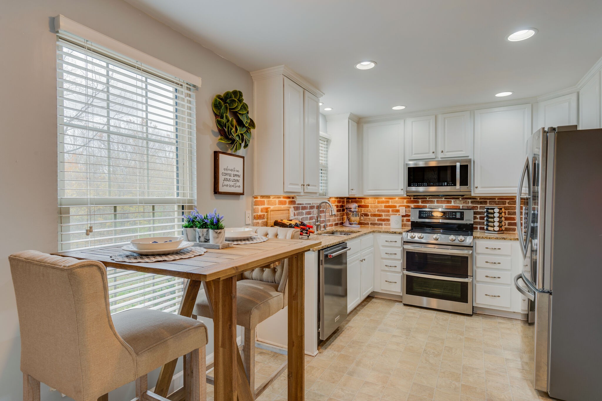 1368 General George Patton Road Nashville, TN 37221 - Photo 3 of 30 a kitchen that has a sink and stainless steel appliances