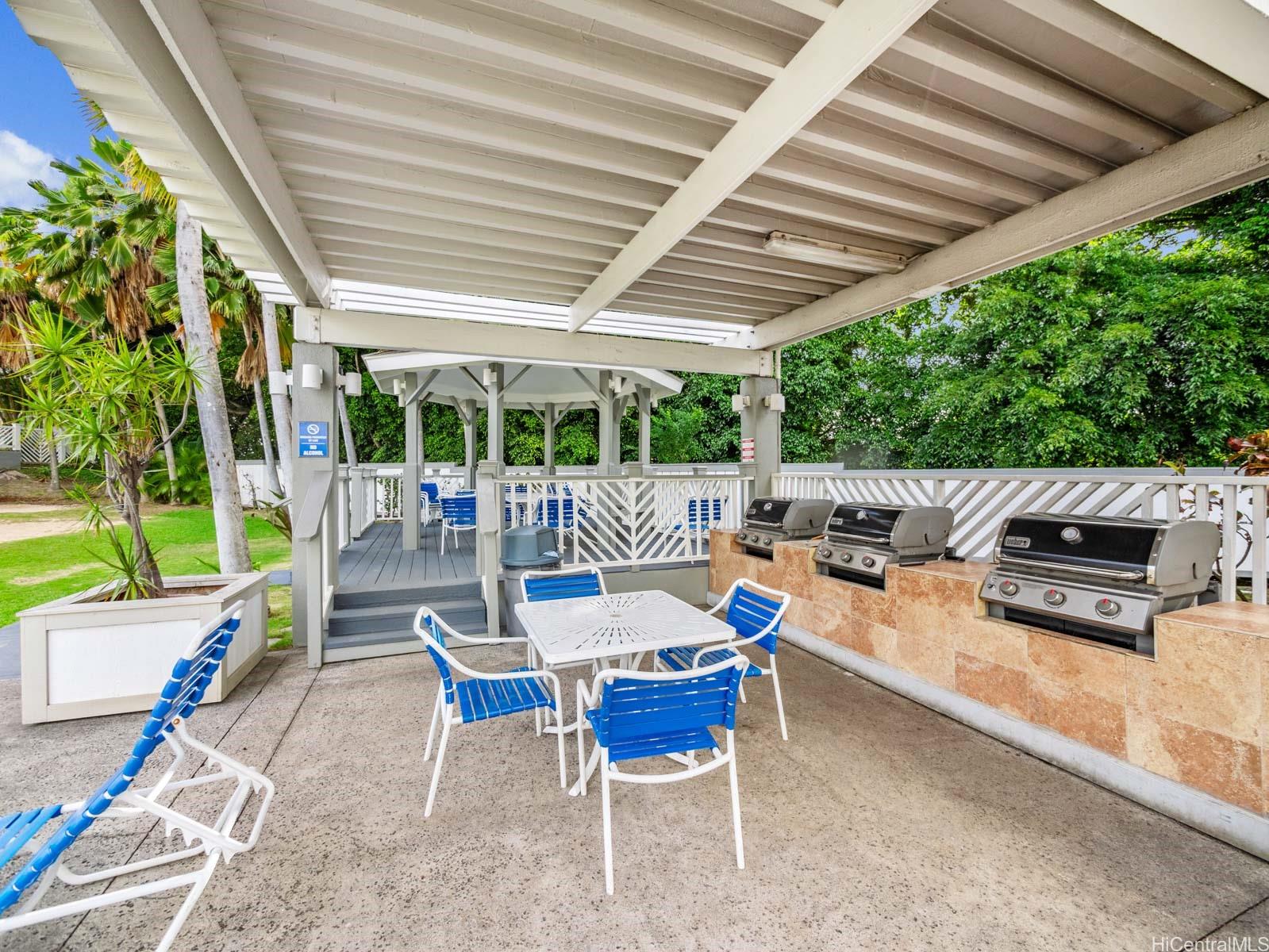 594 Mananai Place, Unit 21T Honolulu, HI 96818 - Photo 23 of 25 a outdoor space with patio lots of furniture and garden view