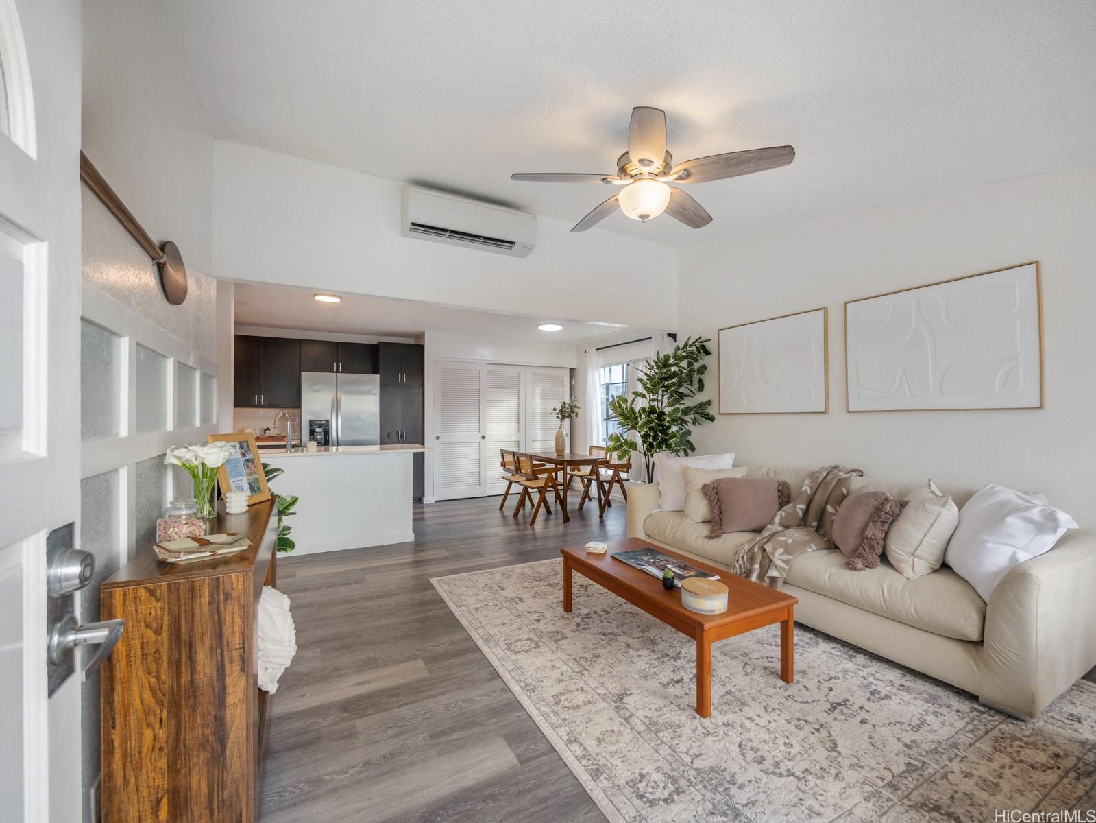 594 Mananai Place, Unit 21T Honolulu, HI 96818 - Photo 6 of 25 a living room with furniture and wooden floor