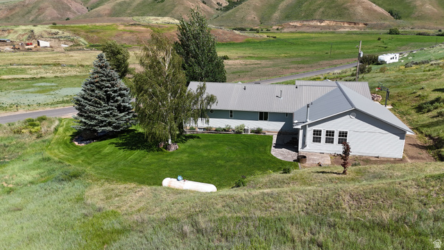 9029 North Treasureton Road Preston, ID 83263 - Photo 24 of 31 Single-story residence featuring light gray siding and a metal roof