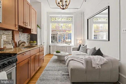 a living room with furniture and a large window