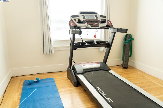 a view of a room with wooden floor and bathroom