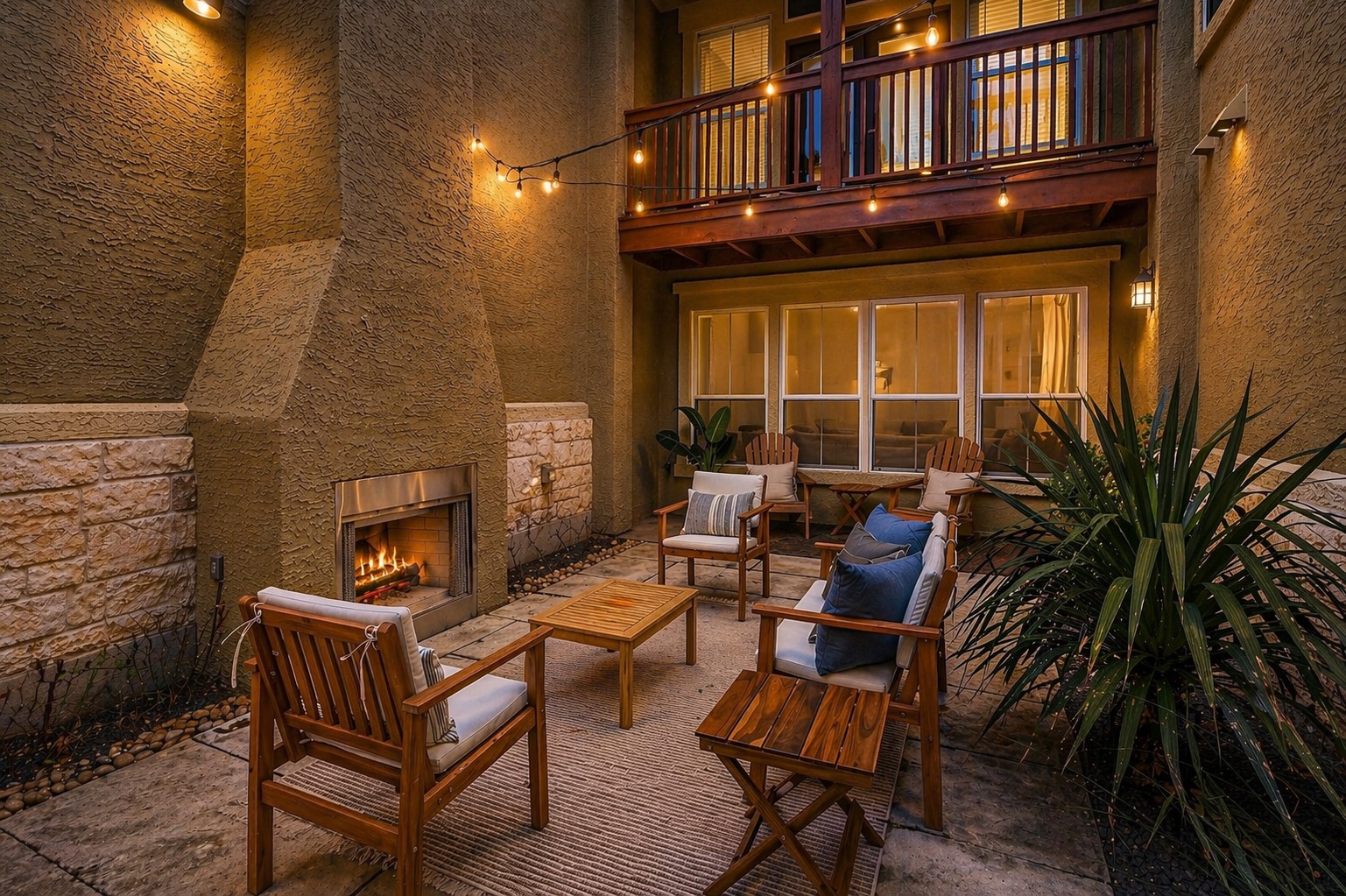 3406 Menchaca Road, Unit 21 Austin, TX 78704 - Photo 3 of 24 a outdoor living space with patio furniture and a fireplace