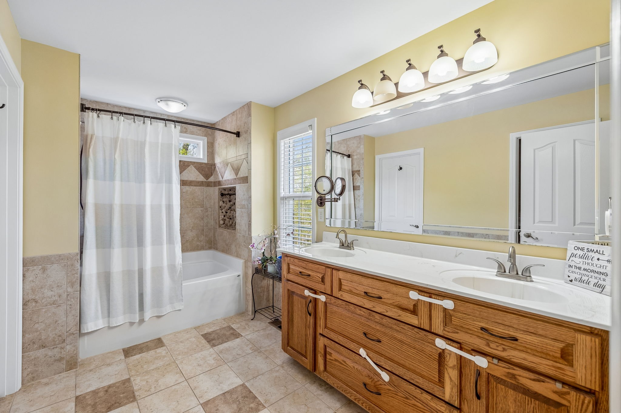 1548 Heller Ridge Spring Hill, TN 37174 - Photo 27 of 73 a bathroom with a double vanity sink mirror double vanity and bathtub