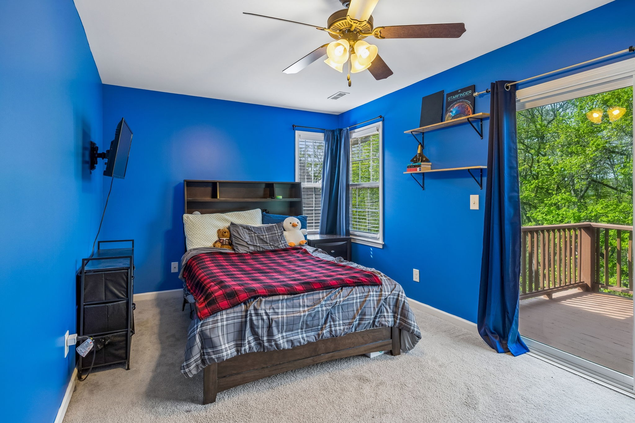 1548 Heller Ridge Spring Hill, TN 37174 - Photo 32 of 73 a bedroom with a bed and a chandelier