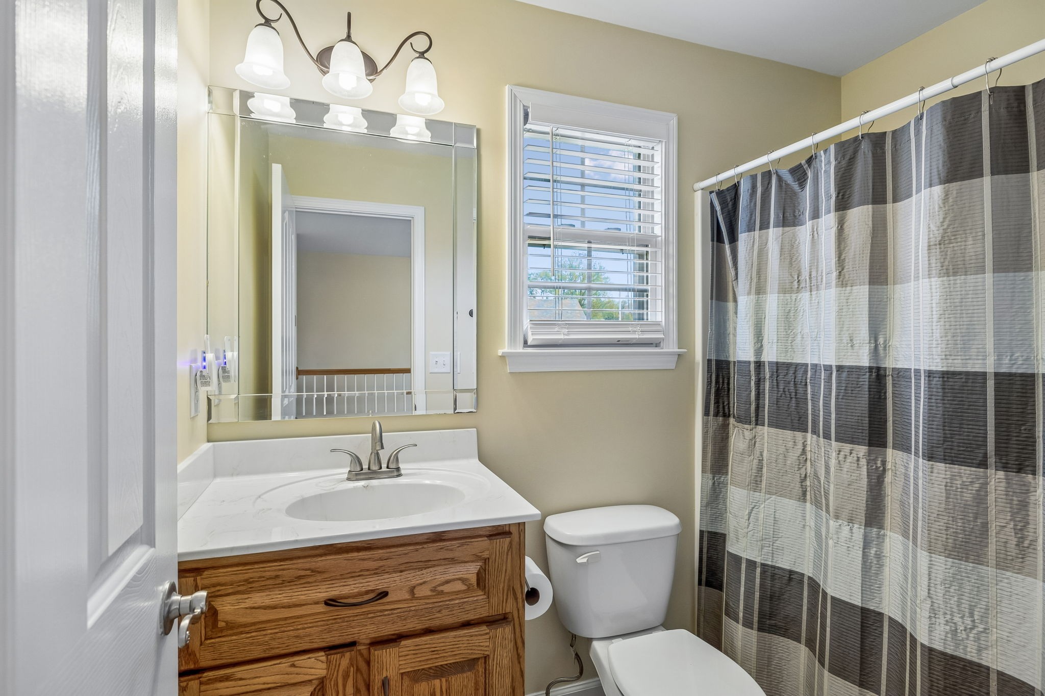 1548 Heller Ridge Spring Hill, TN 37174 - Photo 37 of 73 a bathroom with a sink a toilet a mirror and shower