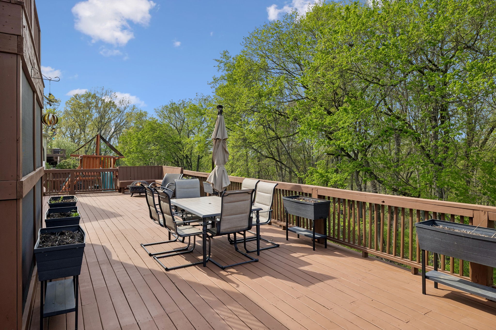1548 Heller Ridge Spring Hill, TN 37174 - Photo 50 of 73 a view of a patio with table and chairs with wooden floor and fence