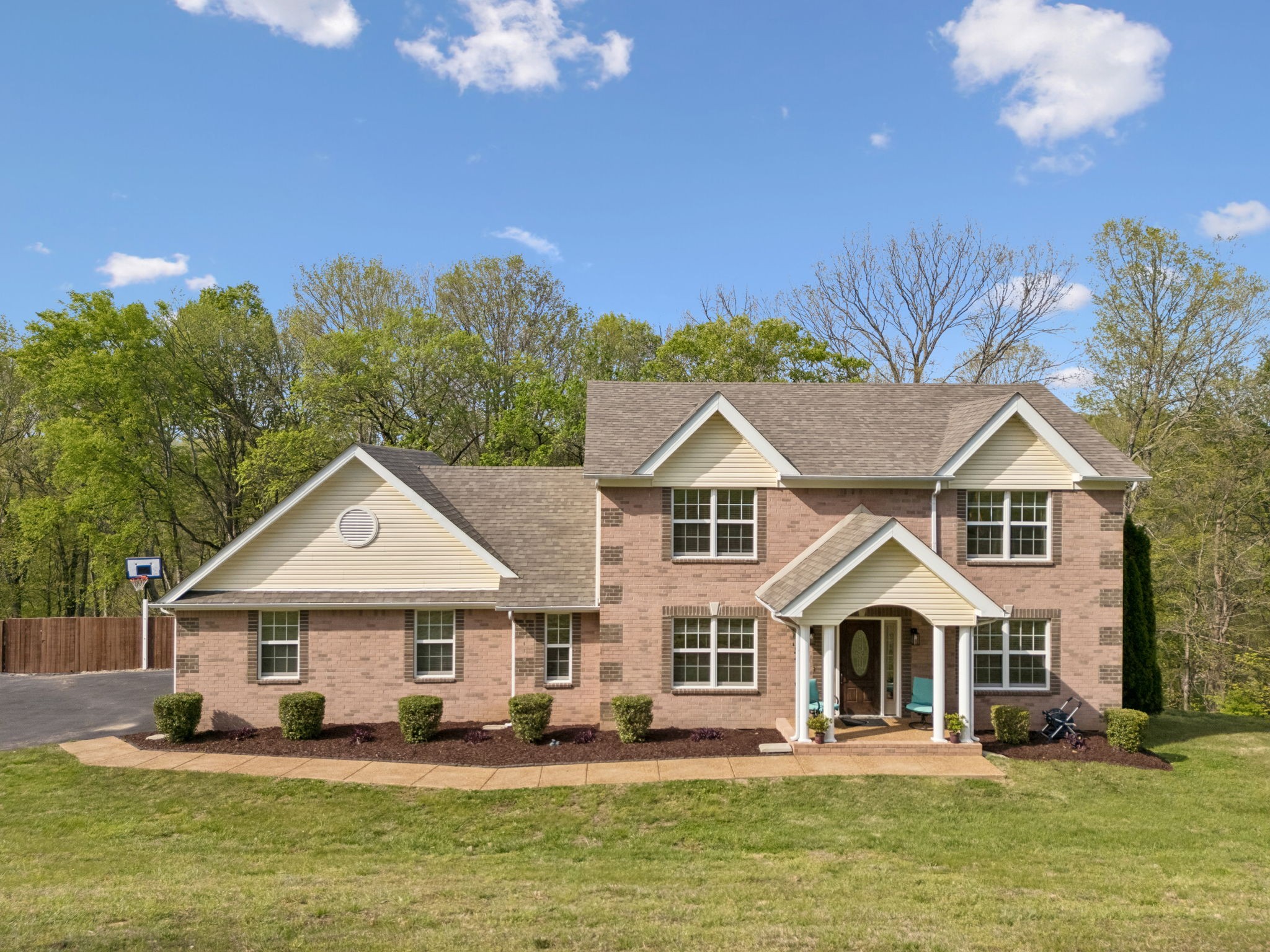 1548 Heller Ridge Spring Hill, TN 37174 - Photo 56 of 73 a front view of a house with a yard