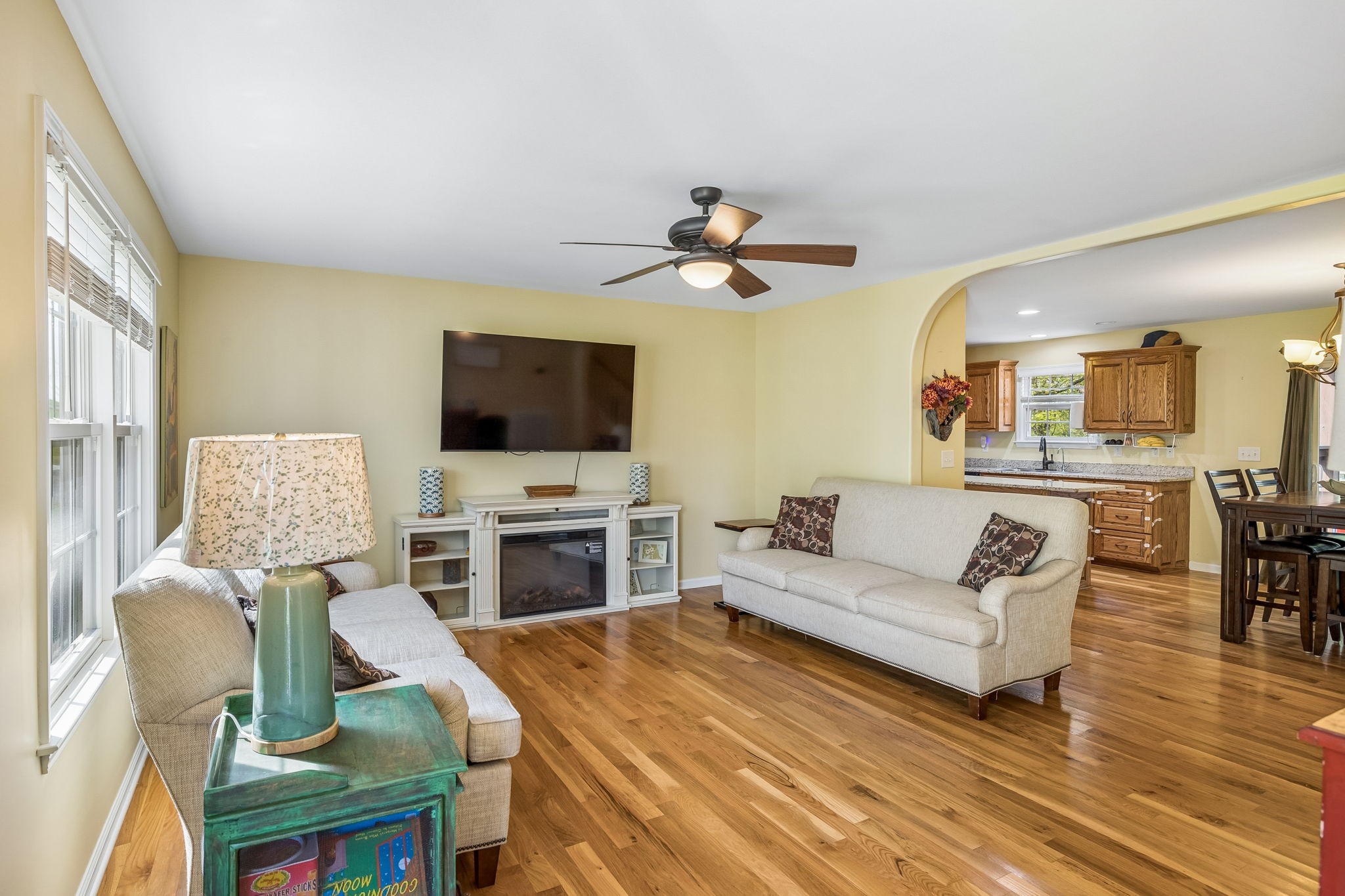 1548 Heller Ridge Spring Hill, TN 37174 - Photo 7 of 73 a living room with furniture a flat screen tv and a fireplace