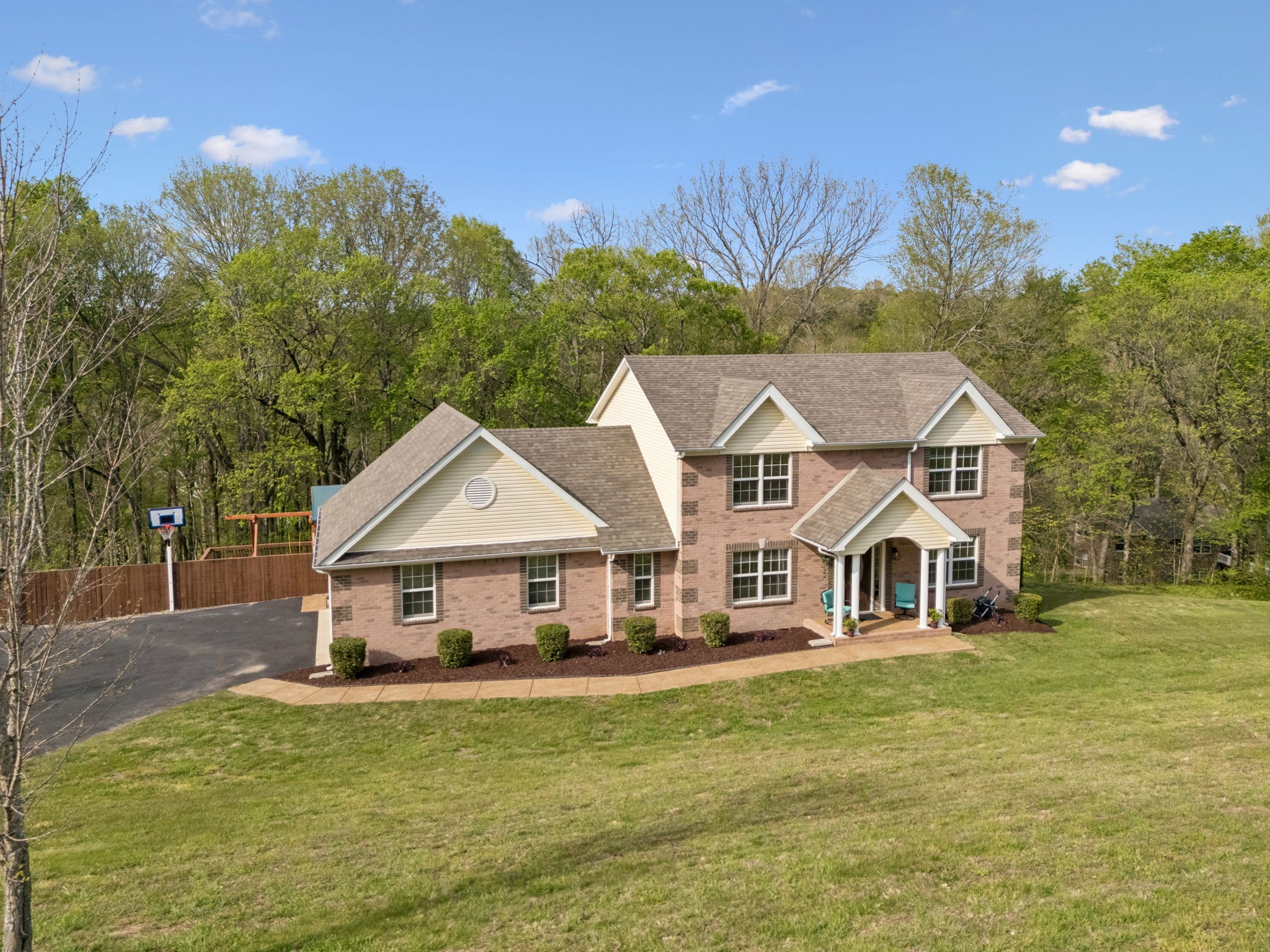 1548 Heller Ridge Spring Hill, TN 37174 - Photo 71 of 73 a view of a white house with a big yard and large trees