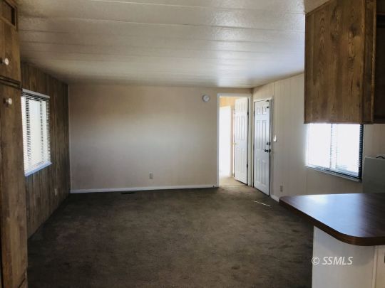 4233 West Ward Avenue Ridgecrest, CA 93555 - Photo 7 of 19 an empty room with windows