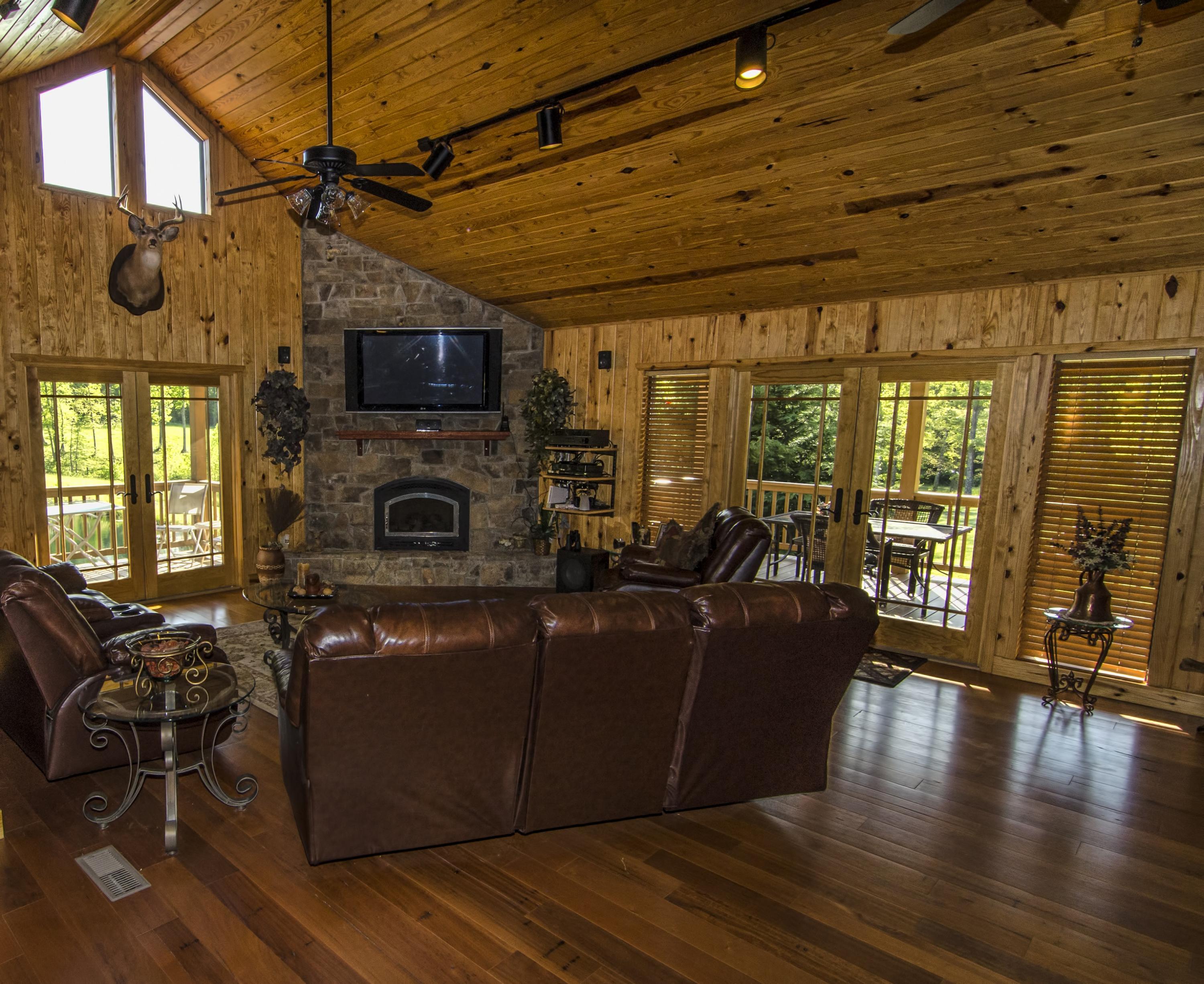 171 Clear Branch Road Dunlap, TN 37327 - Photo 8 of 42 Great room has doors to a deck and a bal
