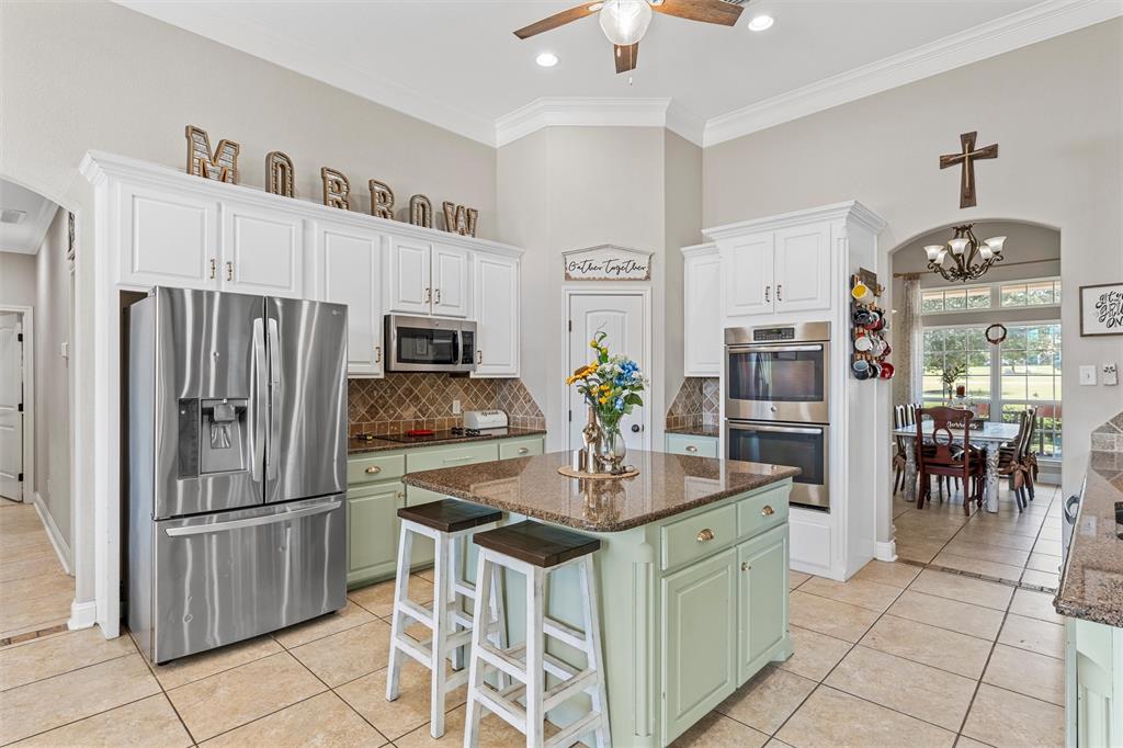 201 Camino Del Rancho Lorena, TX 76655 - Photo 11 of 35 a kitchen with refrigerator and cabinets
