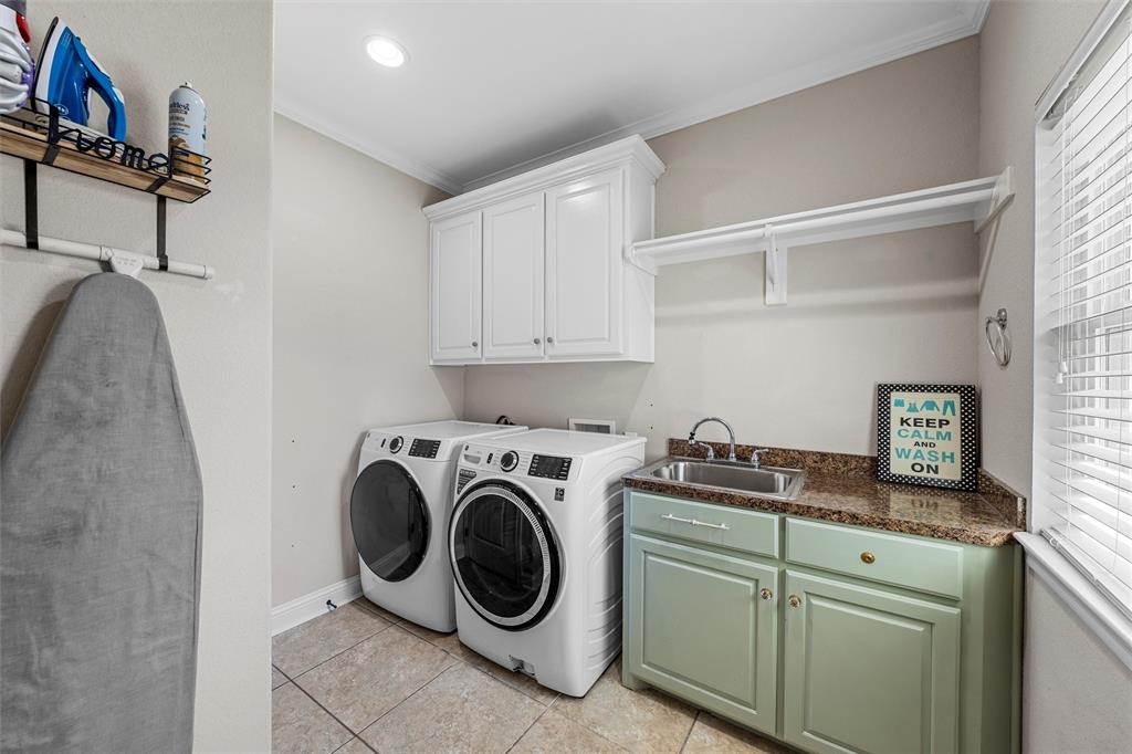 201 Camino Del Rancho Lorena, TX 76655 - Photo 16 of 35 a utility room with sink dryer and washer