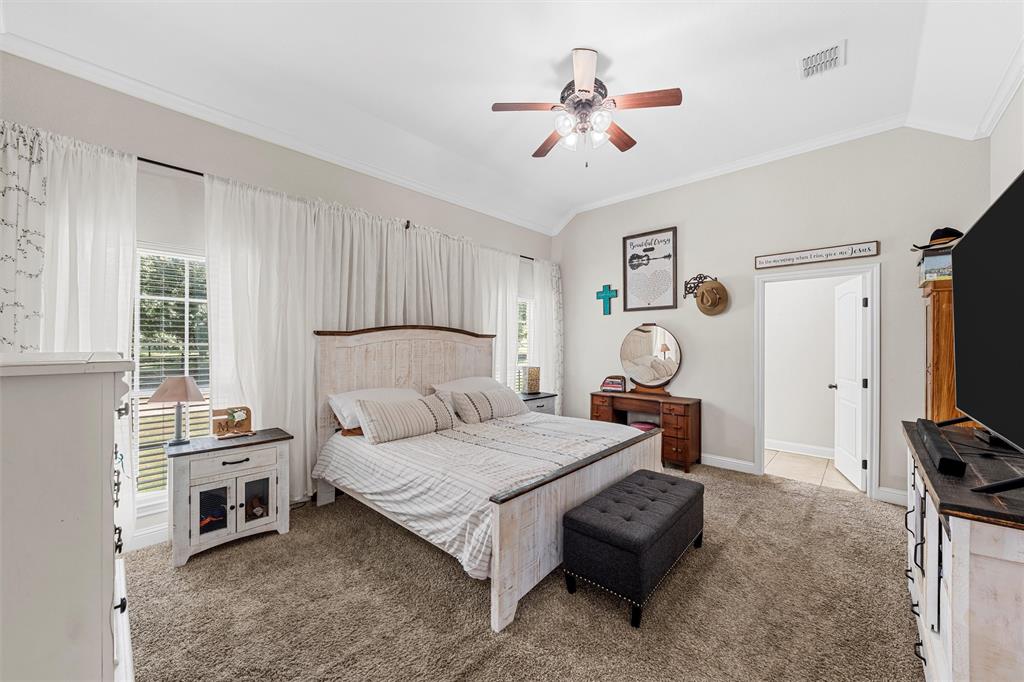 201 Camino Del Rancho Lorena, TX 76655 - Photo 18 of 35 a bedroom with furniture and a flat tv screen
