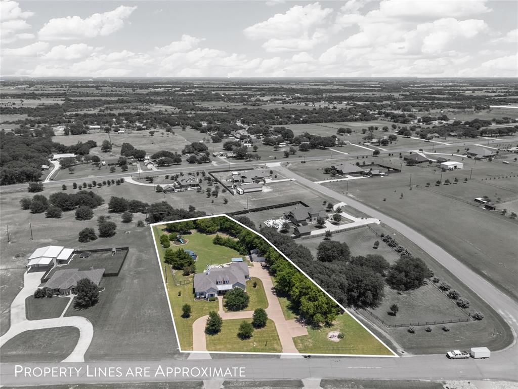 201 Camino Del Rancho Lorena, TX 76655 - Photo 2 of 35 an aerial view of a residential building