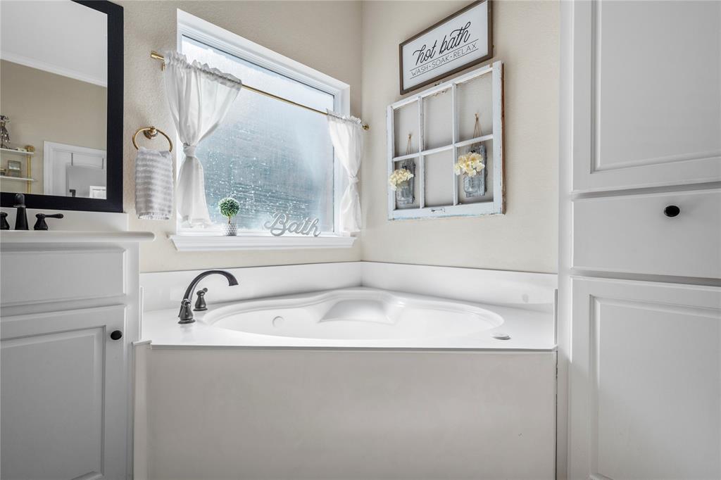 201 Camino Del Rancho Lorena, TX 76655 - Photo 21 of 35 a bathroom with a sink and a large mirror