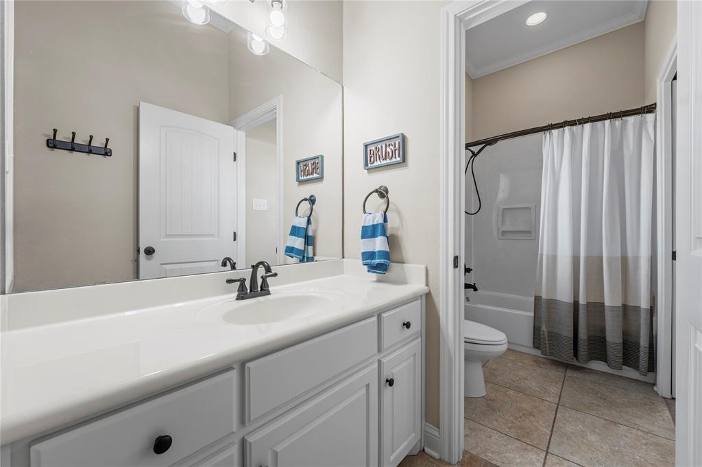 201 Camino Del Rancho Lorena, TX 76655 - Photo 24 of 35 a bathroom with a sink and a mirror