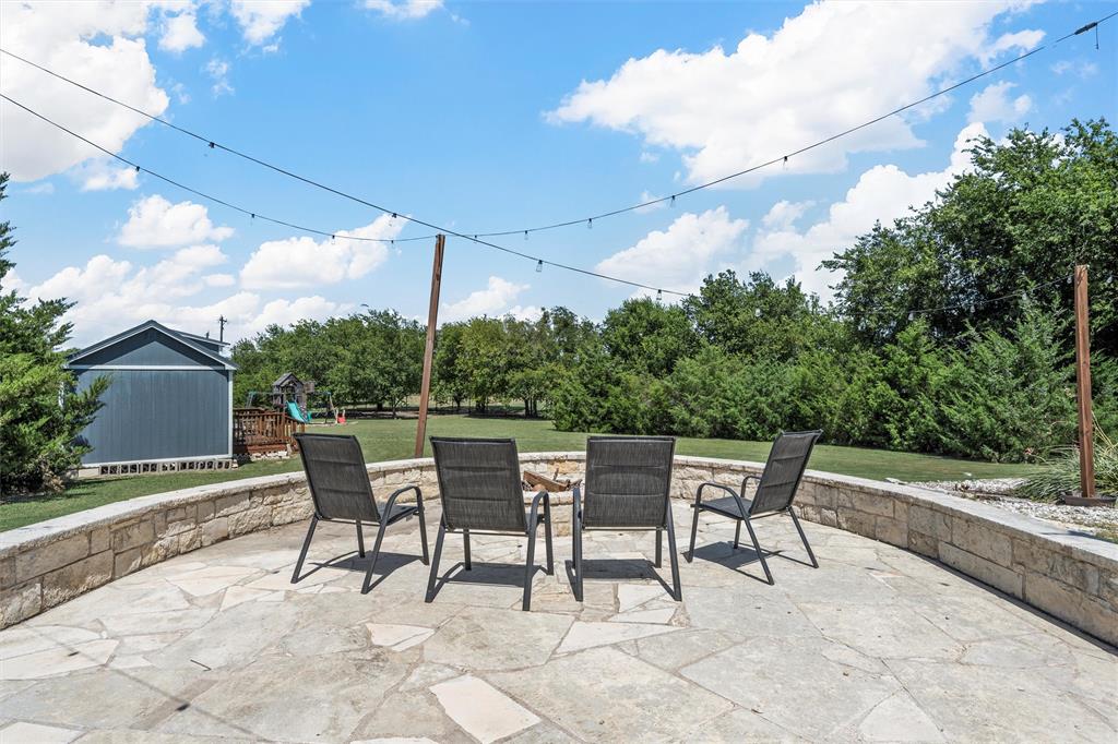 201 Camino Del Rancho Lorena, TX 76655 - Photo 31 of 35 a couple of chairs sitting in middle of a yard