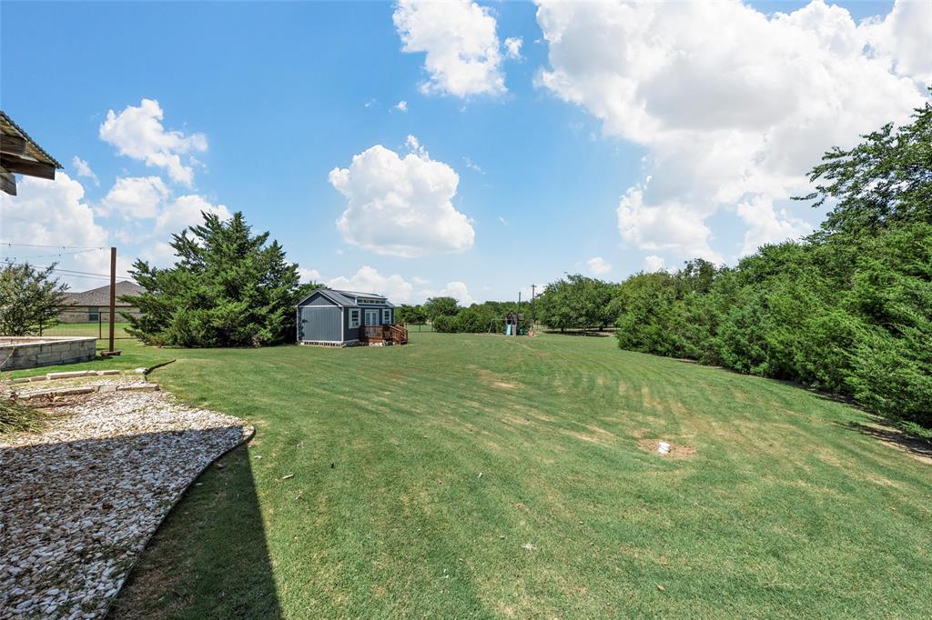 201 Camino Del Rancho Lorena, TX 76655 - Photo 33 of 35 a view of a golf course with a house